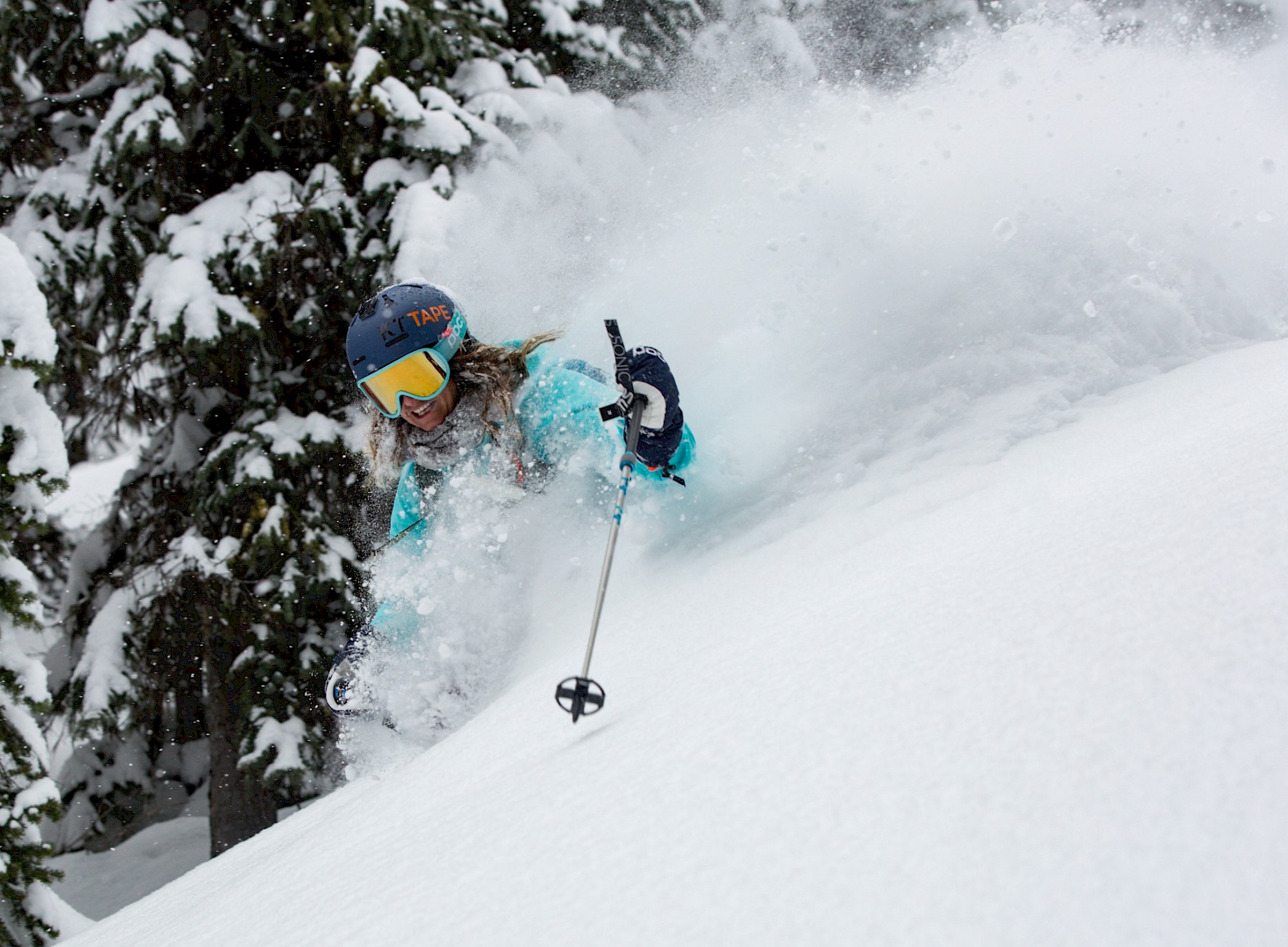 Julia Muncuso at Stellar Heliskiing skiing deep powder.